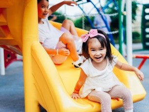 Child coming down a slide