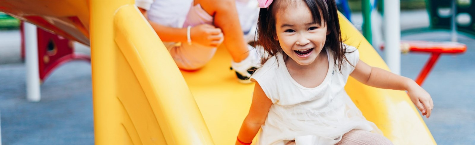 Child coming down a slide