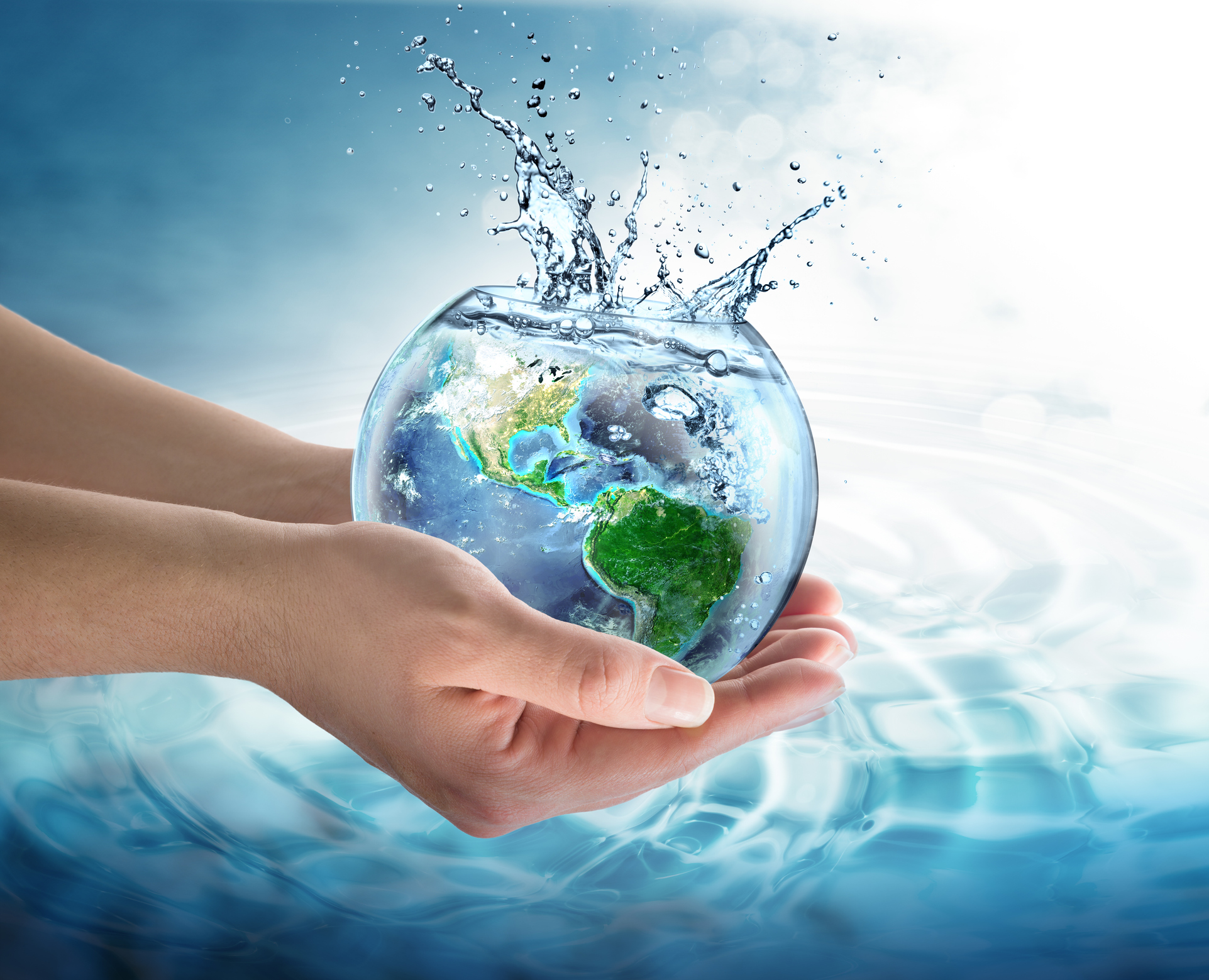 hands holding a globe of water