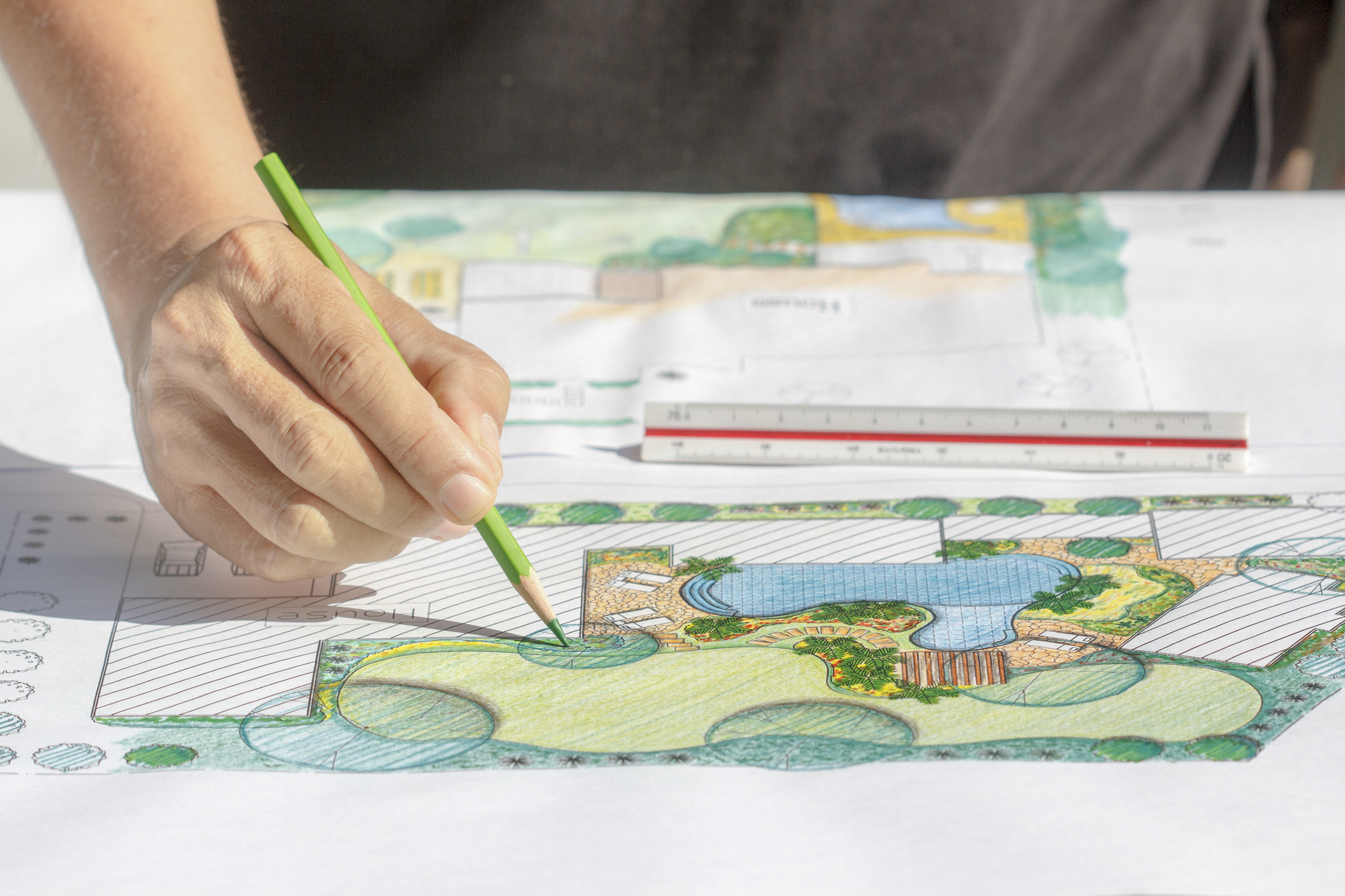 Person drawing on a map