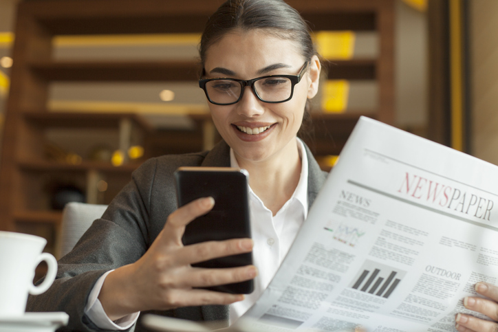 Woman reading news on her phone