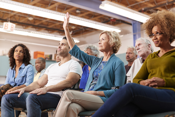 Woman Asking Question At Council Meeting