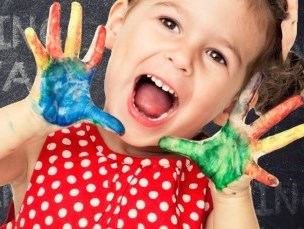 Child with paint on her hands